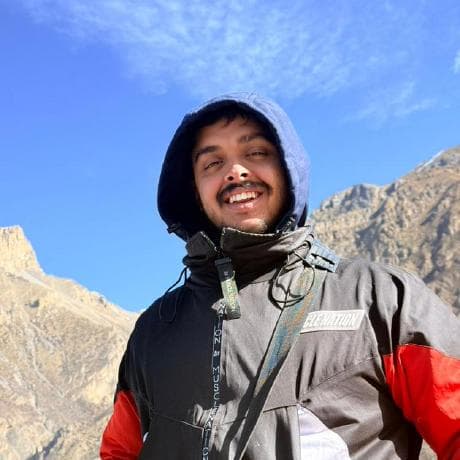 Shaswot Poudyal outdoors in the mountains